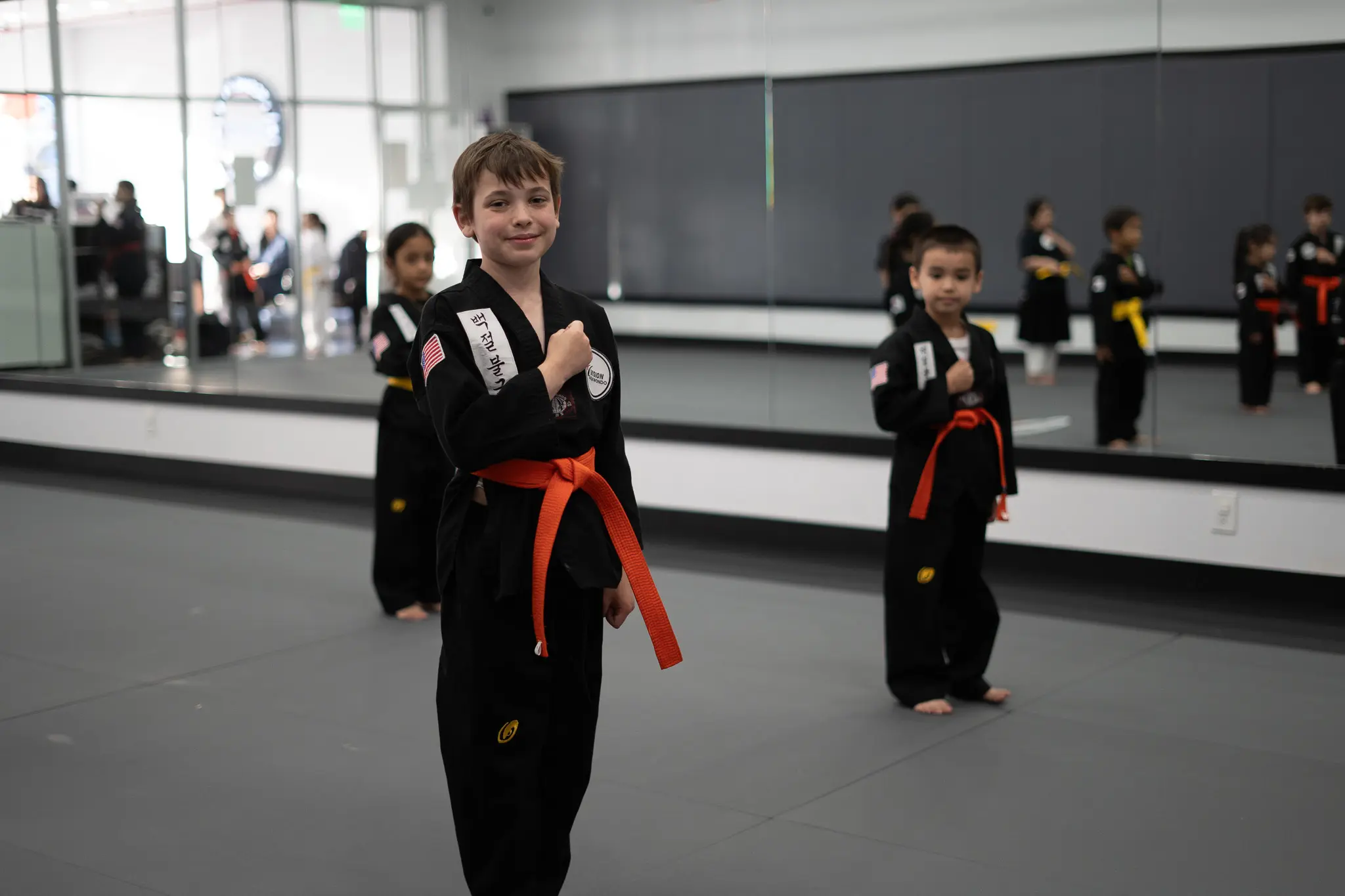 Kids learn coordination, focus, and self-defense in tae kwon do martial arts classes, guided by dedicated instructors.