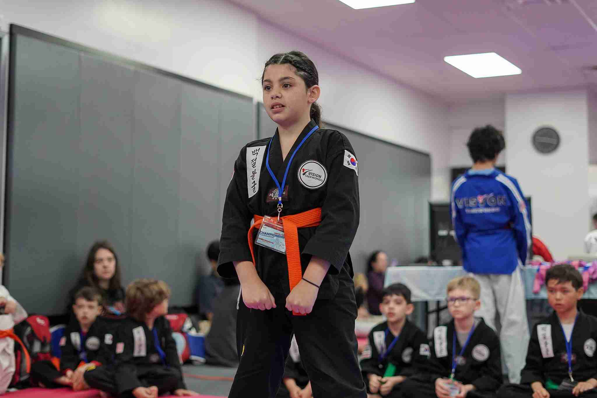 young students learning martial arts discipline