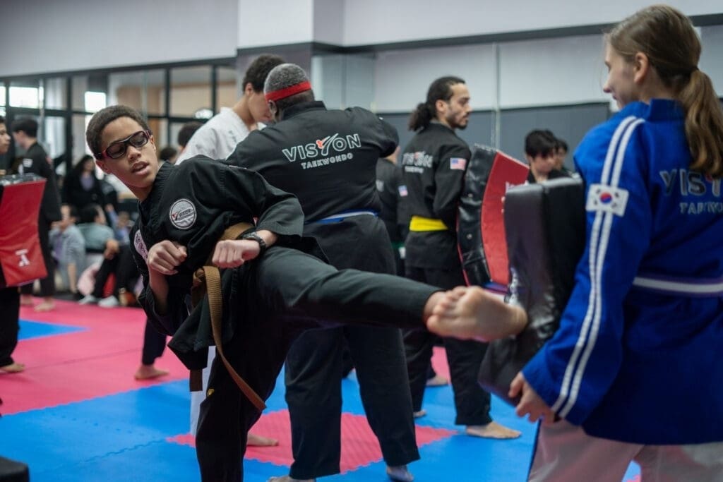 teen doing a straight kick for teens self defense class